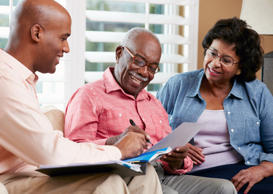 couple working with insurance agent