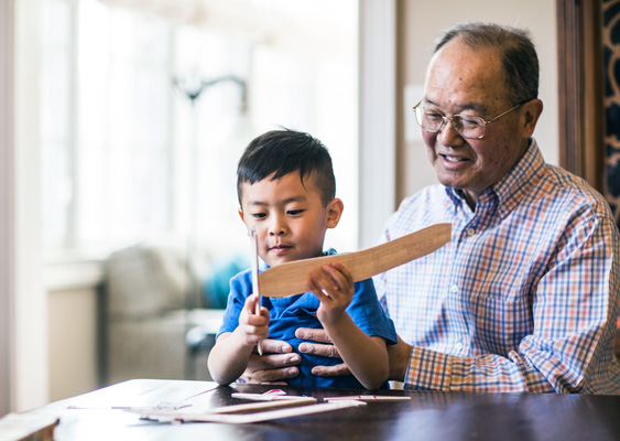 grandfather and grandson with toy airplane