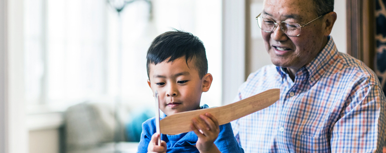 grandfather and grandson with toy airplane